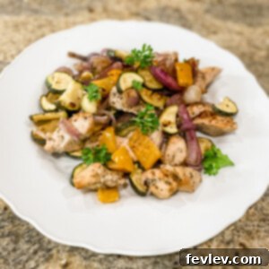 Delicious Seasoned Chicken and Veggies Sheet Pan Dinner, a healthy and quick meal perfect for weeknights.
