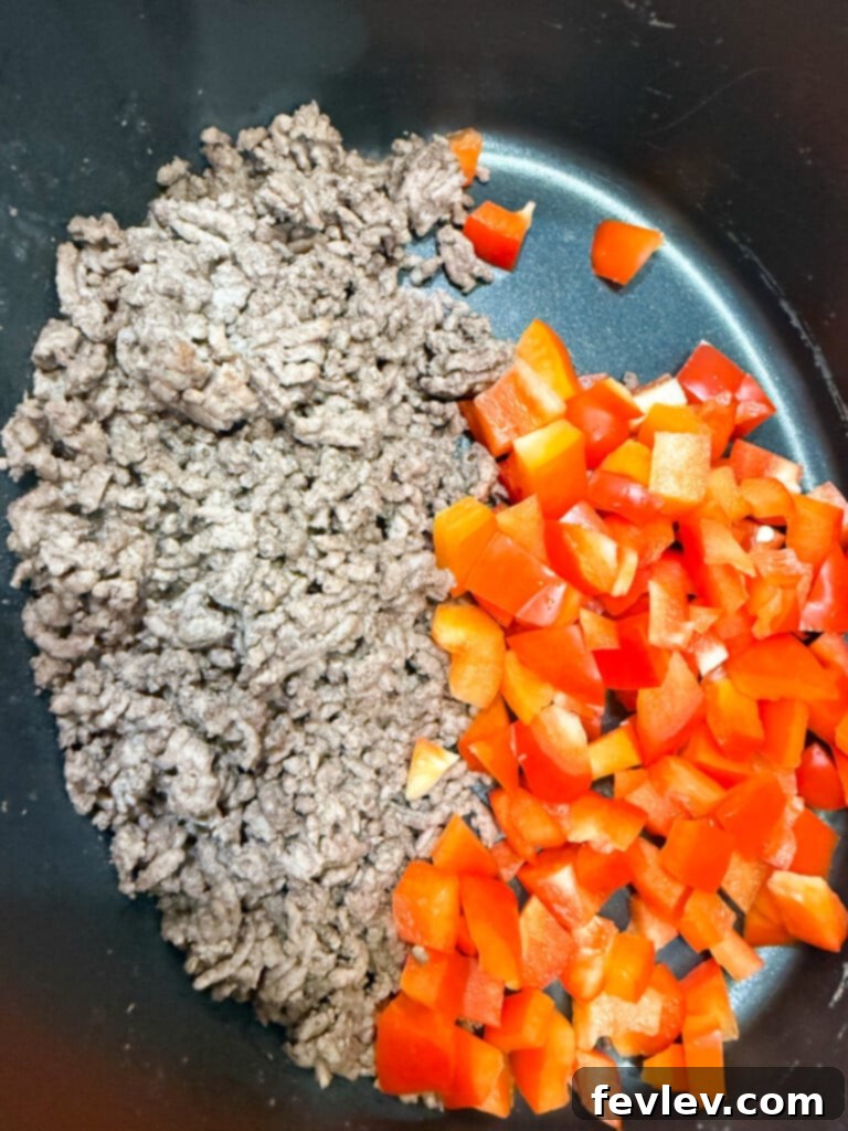Easy Slow Cooker Taco Pasta 3 prepare taco meat mixture