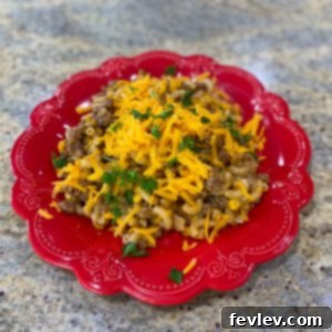 Hearty Beef Pasta BBQ Skillet with melted cheese and corn, ready to be served