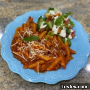 Delicious One-Pan Sausage Pasta with Penne, Marinara, and Melted Mozzarella