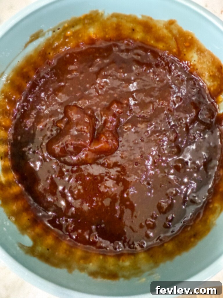 Mixing apricot and BBQ sauce for pork chops