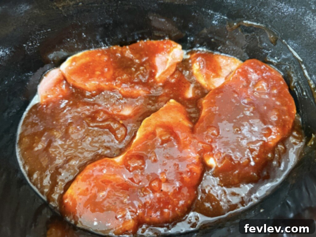 Adding BBQ sauce to pork chops in slow cooker