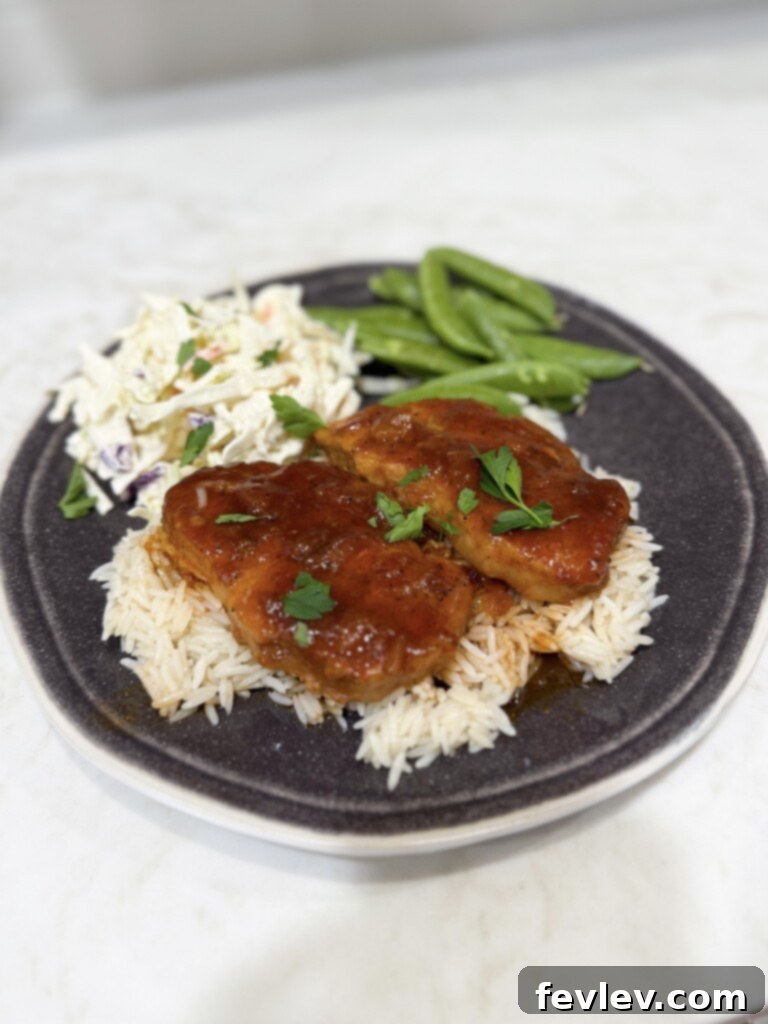 Easy BBQ pork chop recipe served with tasty sides