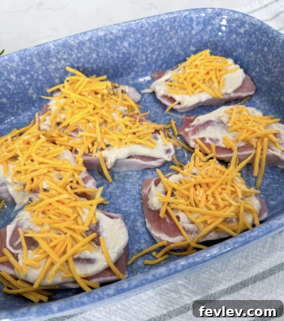 French Onion Glazed Pork Chops 4 Layering cheese and crispy fried onions on French Onion Pork Chops.