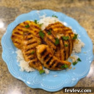 Delicious Hawaiian Pineapple Chicken and Coconut Rice served on a plate