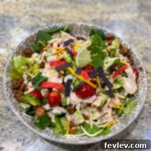 Creamy Southwest Dressing drizzled over a fresh taco salad
