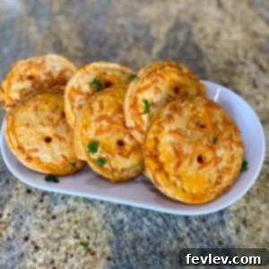 Delicious mini pizzas made with flaky Pillsbury pie crust, topped with pepperoni and cheese.