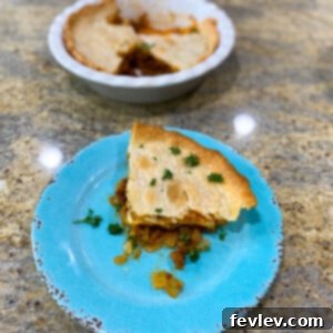 Delicious golden brown Cheeseburger Pot Pie with a flaky crust, ready to serve for a family dinner