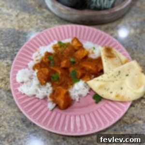 Delicious Slow Cooker Coconut Curry served over white rice with naan bread