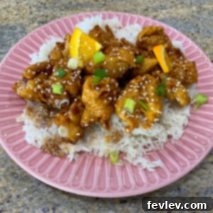 Crispy Homemade Orange Chicken with a vibrant sauce