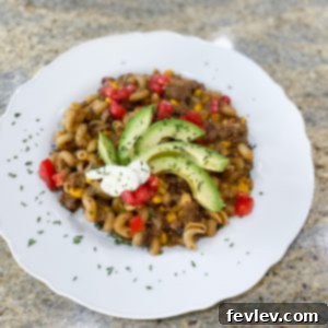 Delicious One-Pot Beef & Cheese Taco Pasta ready to serve, garnished with fresh cilantro.