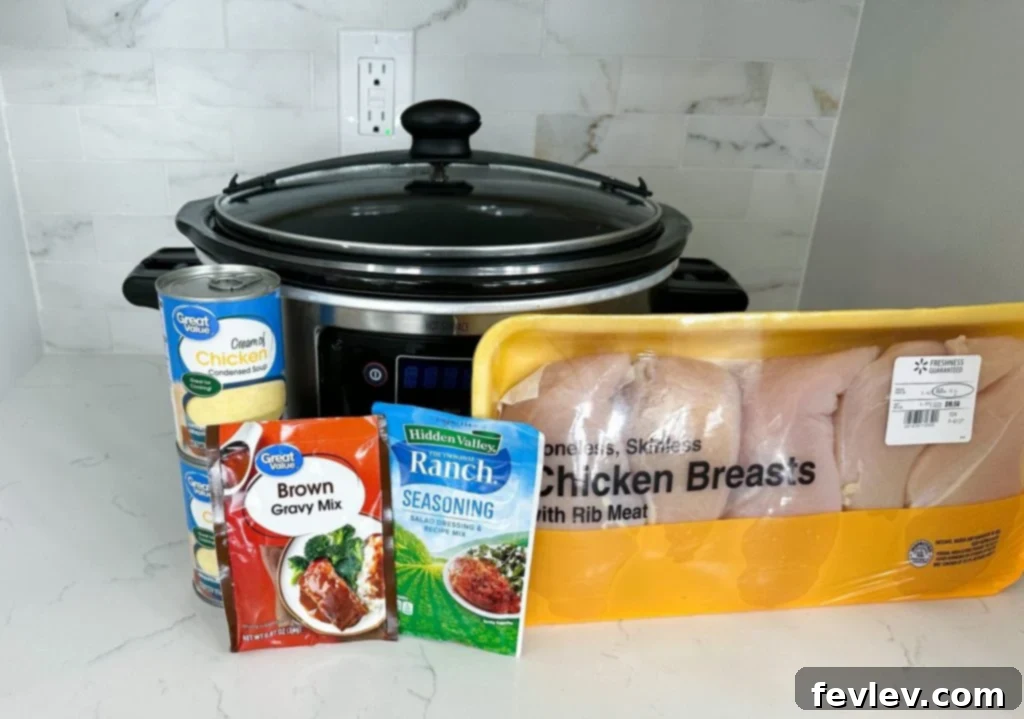 Creamy Slow Cooker Chicken and Gravy served with mashed potatoes and peas