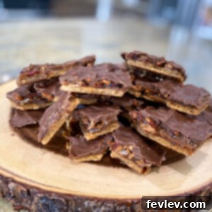 Delicious Christmas Crack Toffee Bars, a perfect holiday treat with a graham cracker base, rich toffee, chocolate, and pecans.