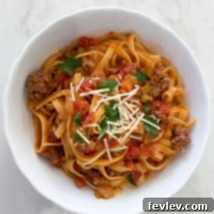 Plated One-Pot Beef Bolognese with fresh pasta and Parmesan