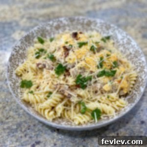Delicious Baked Tuscan Chicken served with pasta