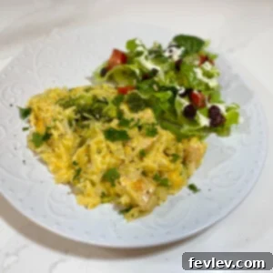 A deliciously creamy cheesy orzo and broccoli dish with tender chicken pieces
