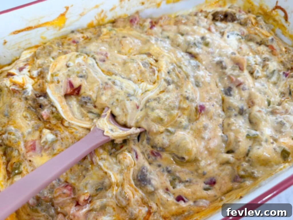 Epic Loaded Baked Queso 6 Melty cheesy ground beef queso fresh from the oven