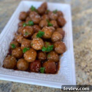 Delicious Honey BBQ Crockpot Meatballs served with parsley and sesame seeds
