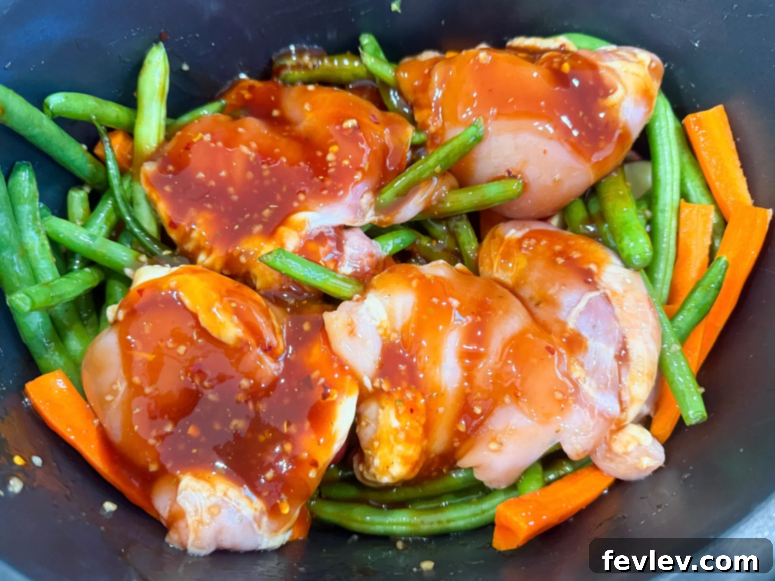 Pouring Sauce over Chicken and Vegetables