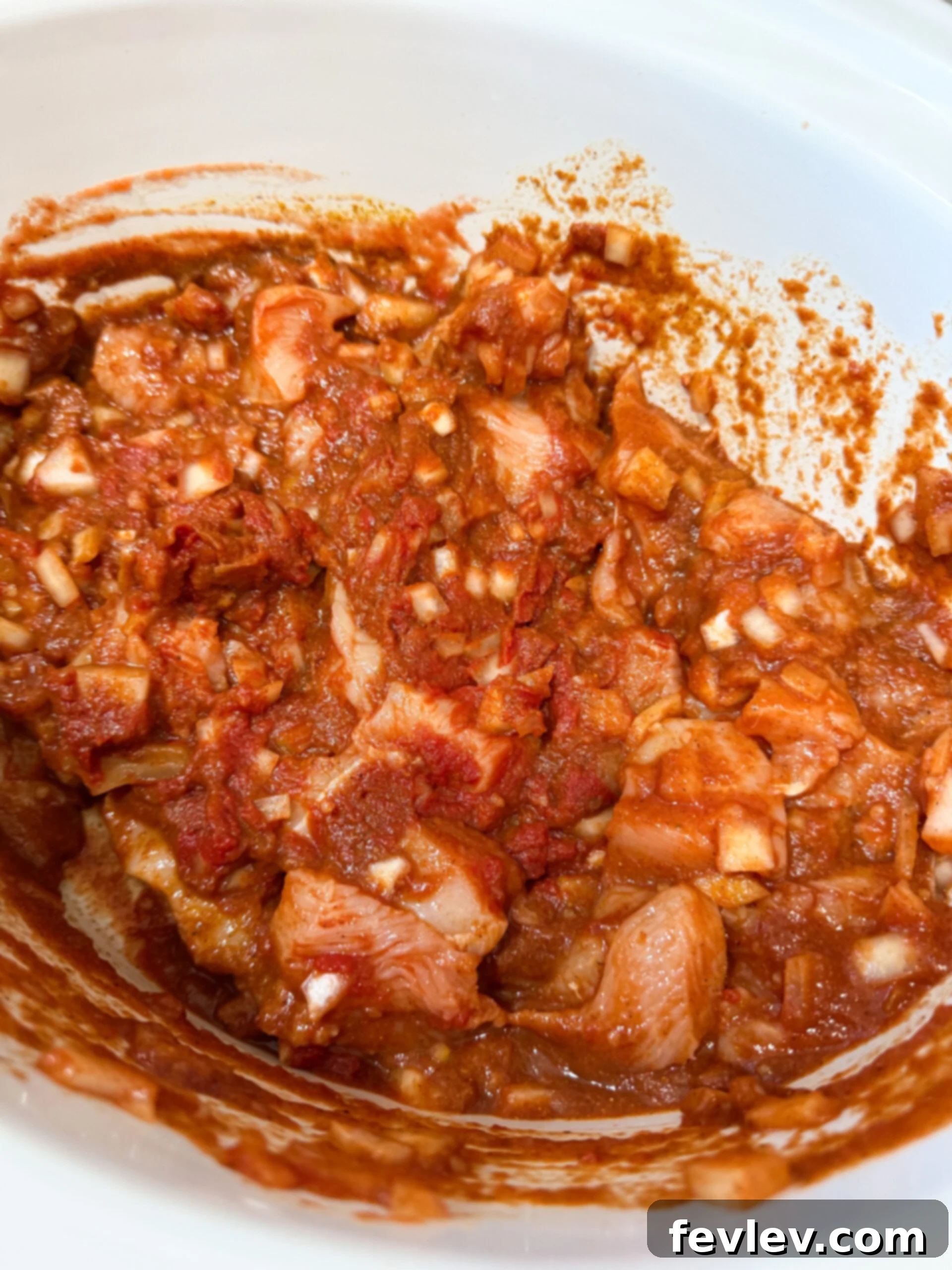 Slow Cooker Butter Chicken Bliss 5 Chicken and sauce stirred