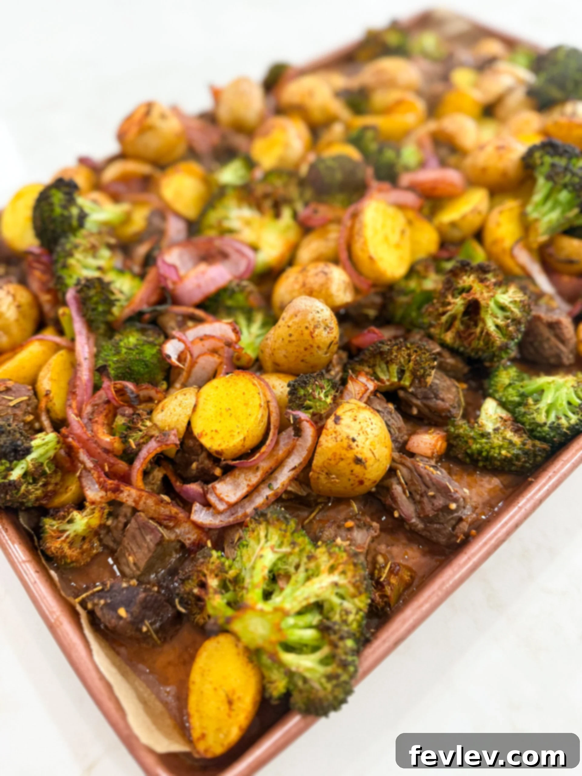 Garlic Butter Steak Bites with Roasted Veggies 5 Sheet pan with roasted steak bites and vegetables.