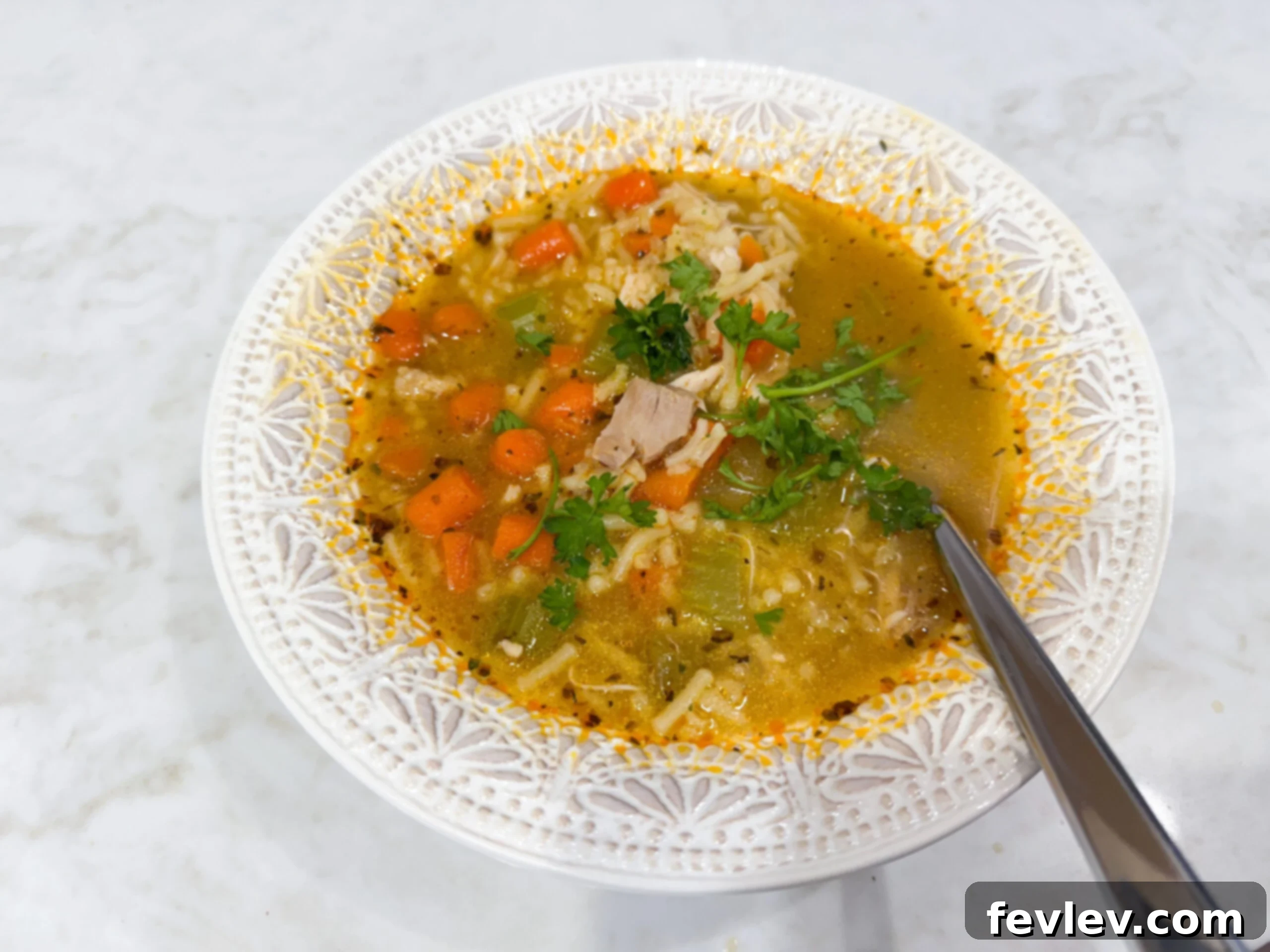 Chicken and Rice Soup made with Rice-A-Roni, Carrots, Celery, and Shredded Chicken