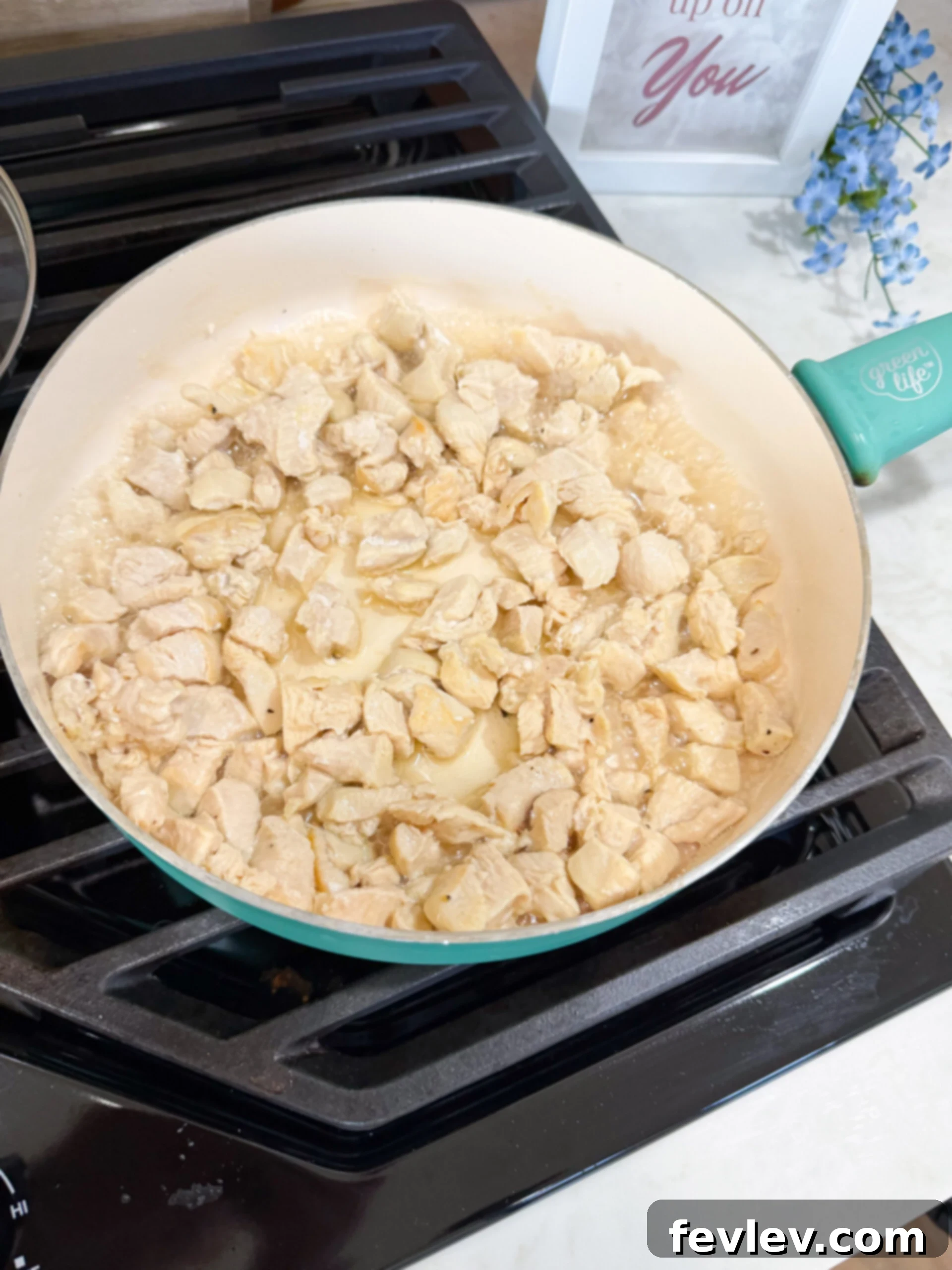 Chicken cooking in skillet