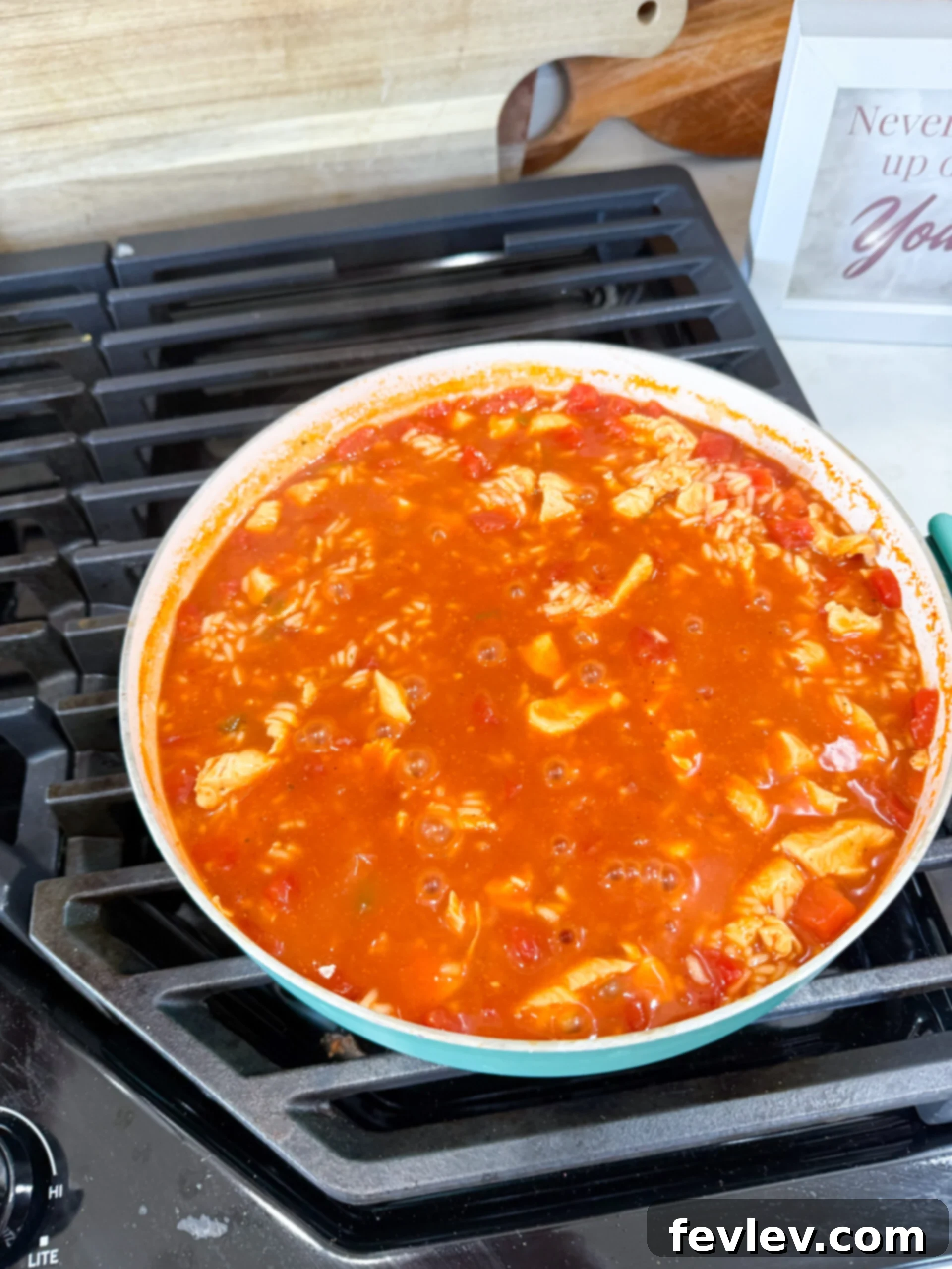 Rice and broth added to skillet
