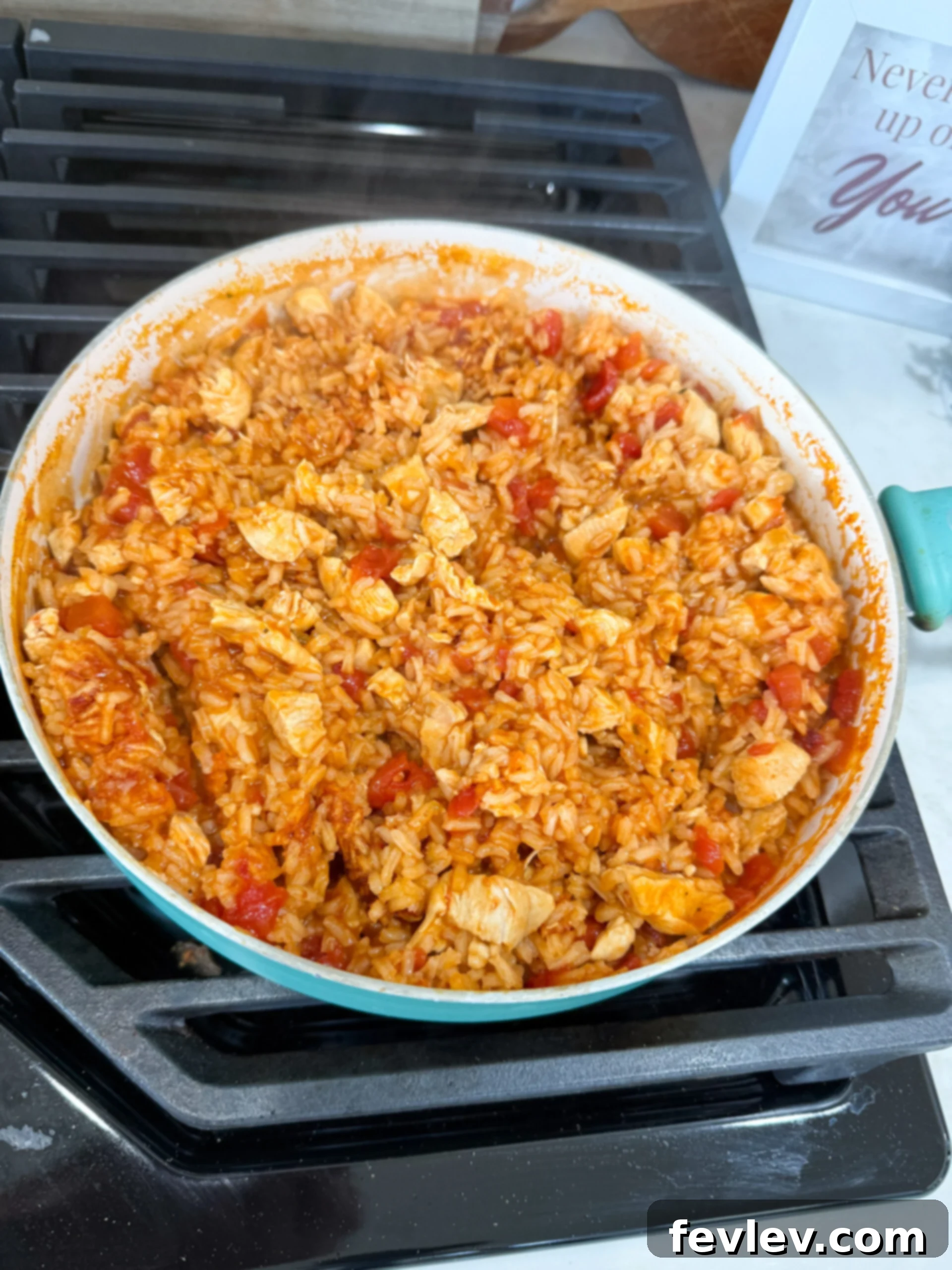 Chicken Taco Rice simmering in a skillet